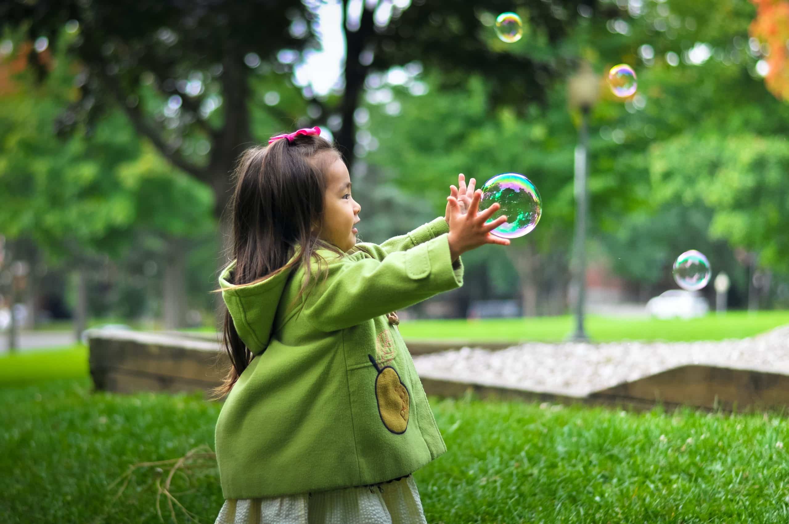 Kid Playing with Bubble Outside