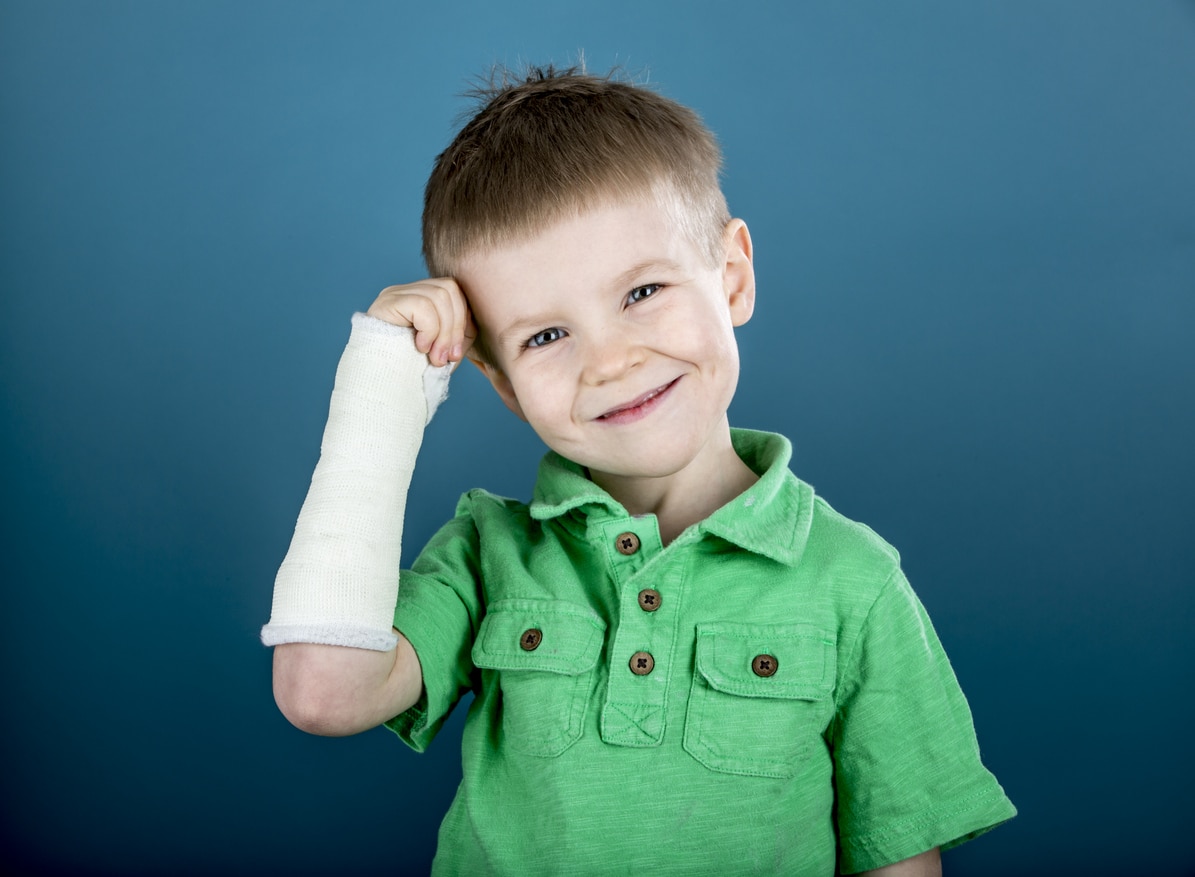 Broken bones in children - little boy with a broken arm